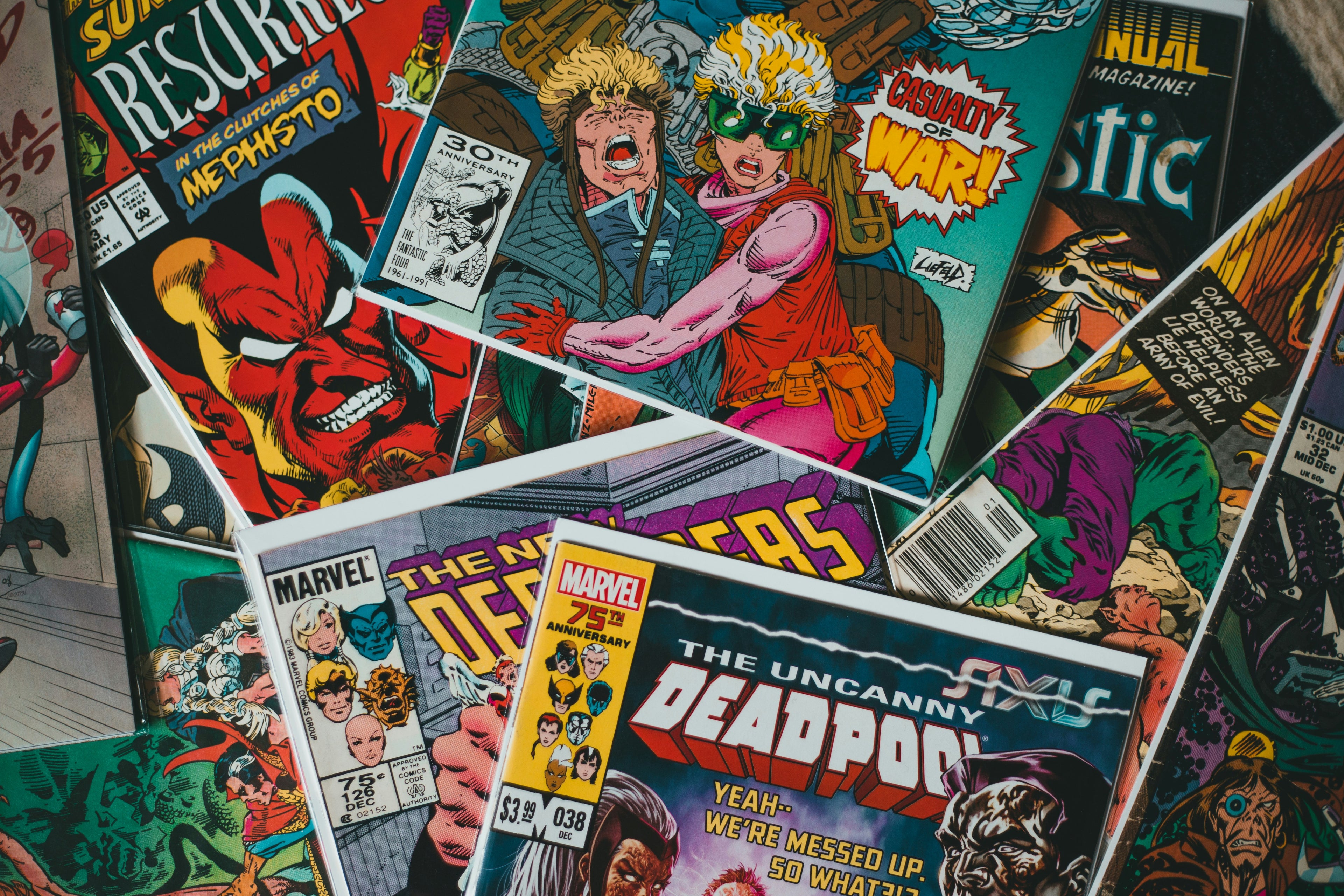 Collection of comic books with various covers and characters.