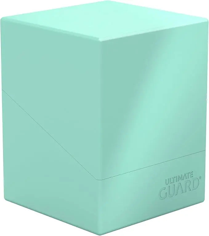 Mint green card storage box with 'Ultimate Guard' branding on a white background