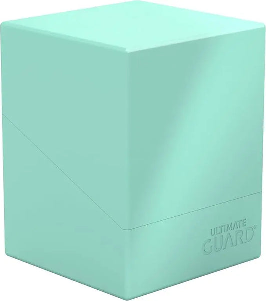 Mint green card storage box with 'Ultimate Guard' branding on a white background