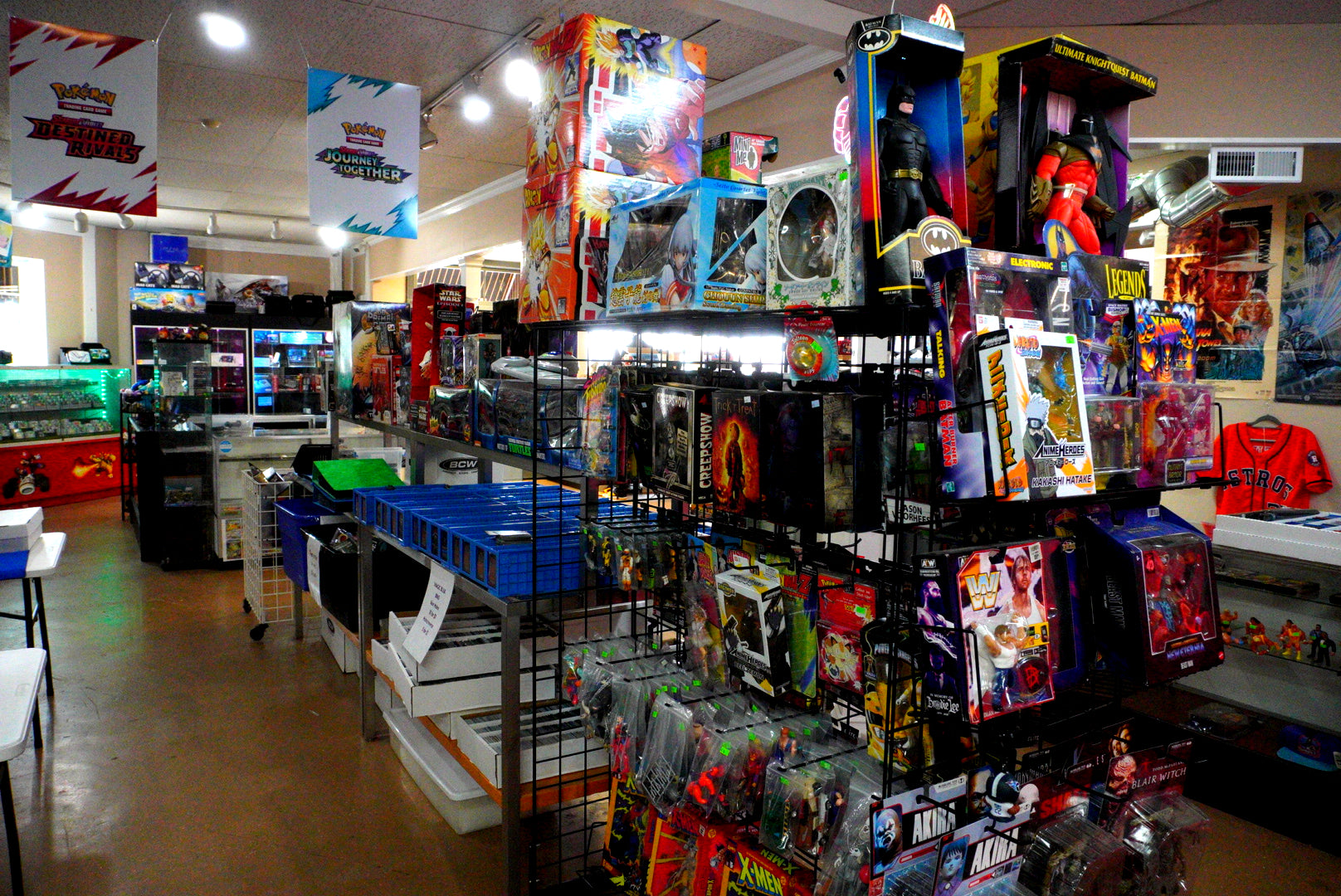 Toy store aisle with various toys on shelves and display racks.